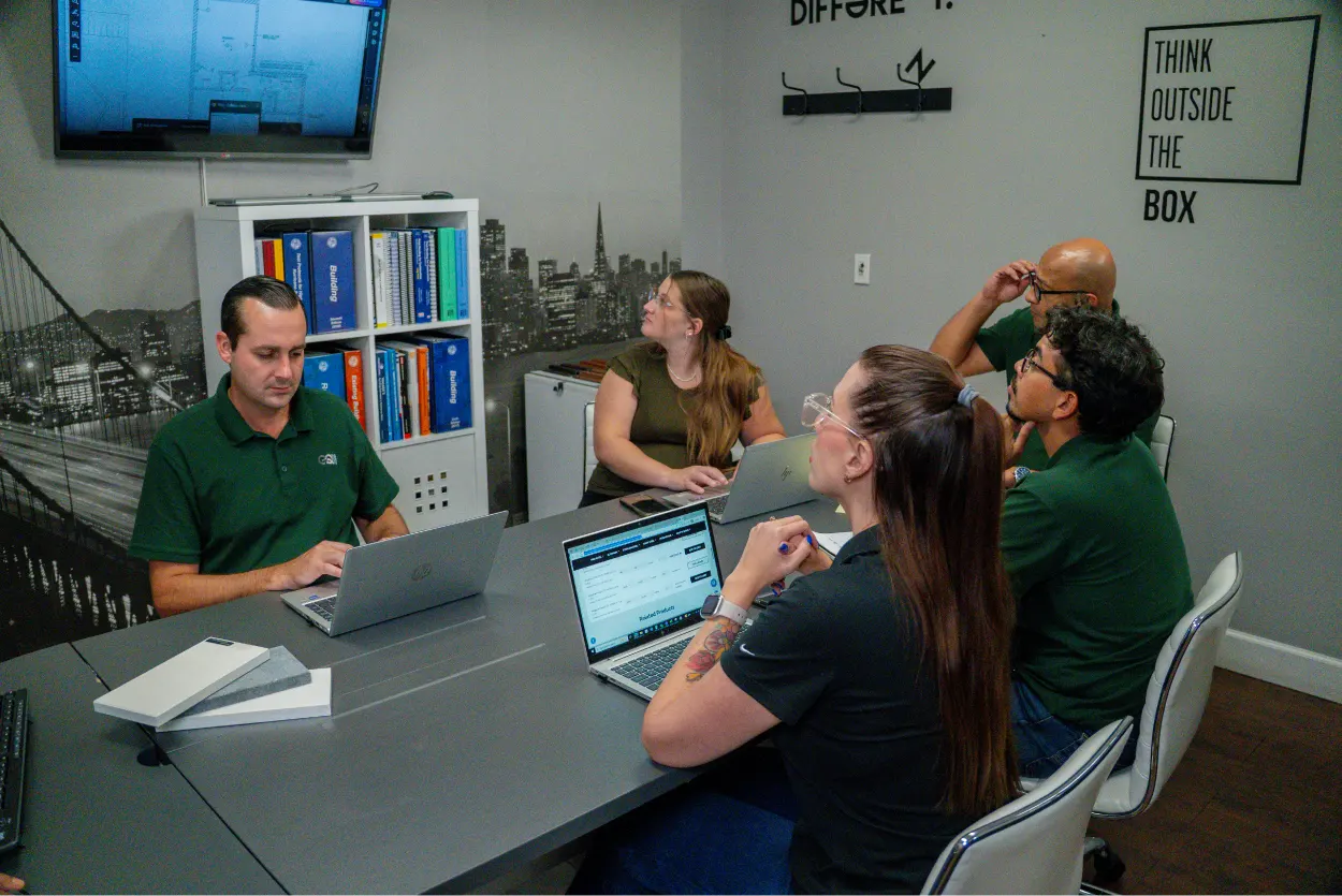 GQM Inc. project management team collaborating on construction planning and operations in Florida.
